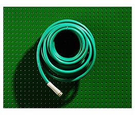 Green pegboard with hose